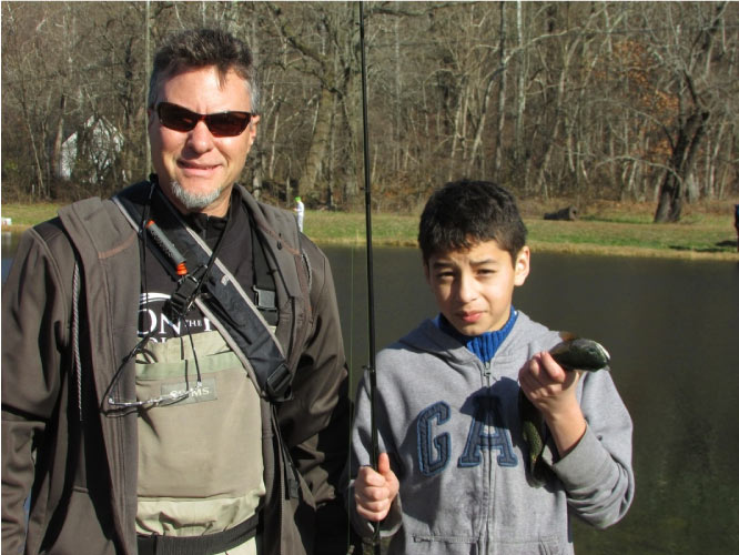 Science teacher Jeff Peake takes On the Road Youth fishing to learn about the environment