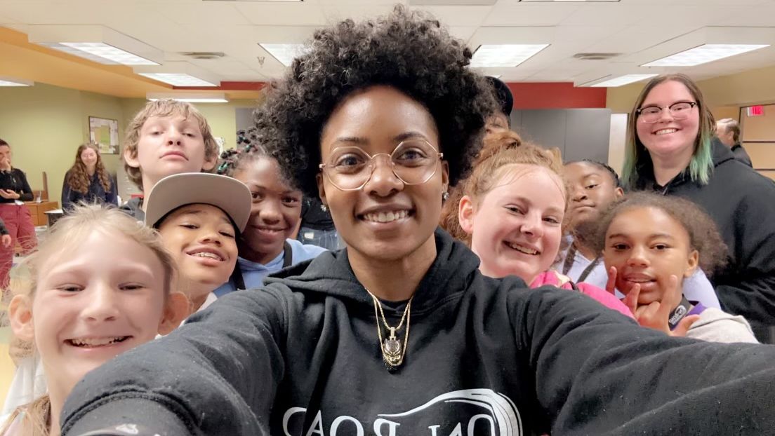 Angela Mickens selfie with students